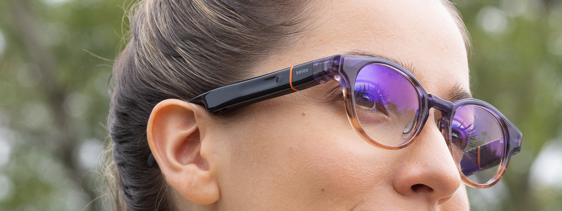 Wearer with prescription lenses fitted to Solos smartglasses